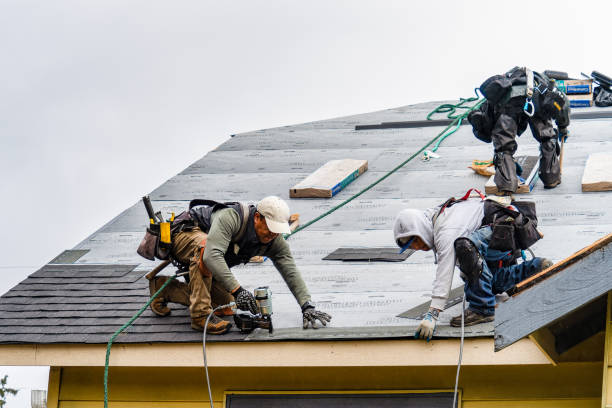 Professional Gutter Installation technician working in Bellport, NY